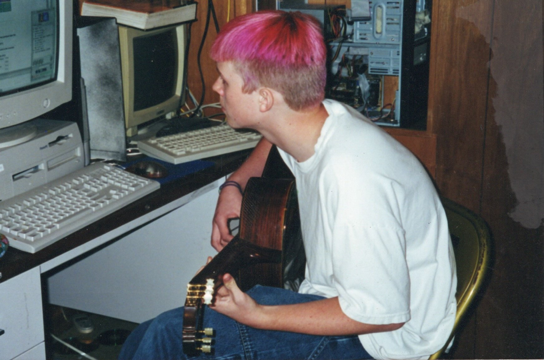 Cassidy Barton in 1997 — pink hair, guitar, sitting at a CRT computer